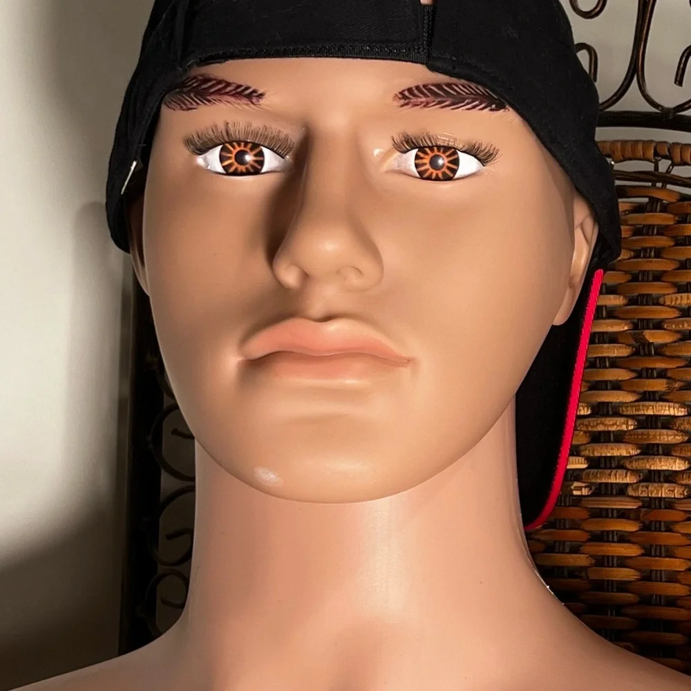 A one size fits all Black ball Cap 